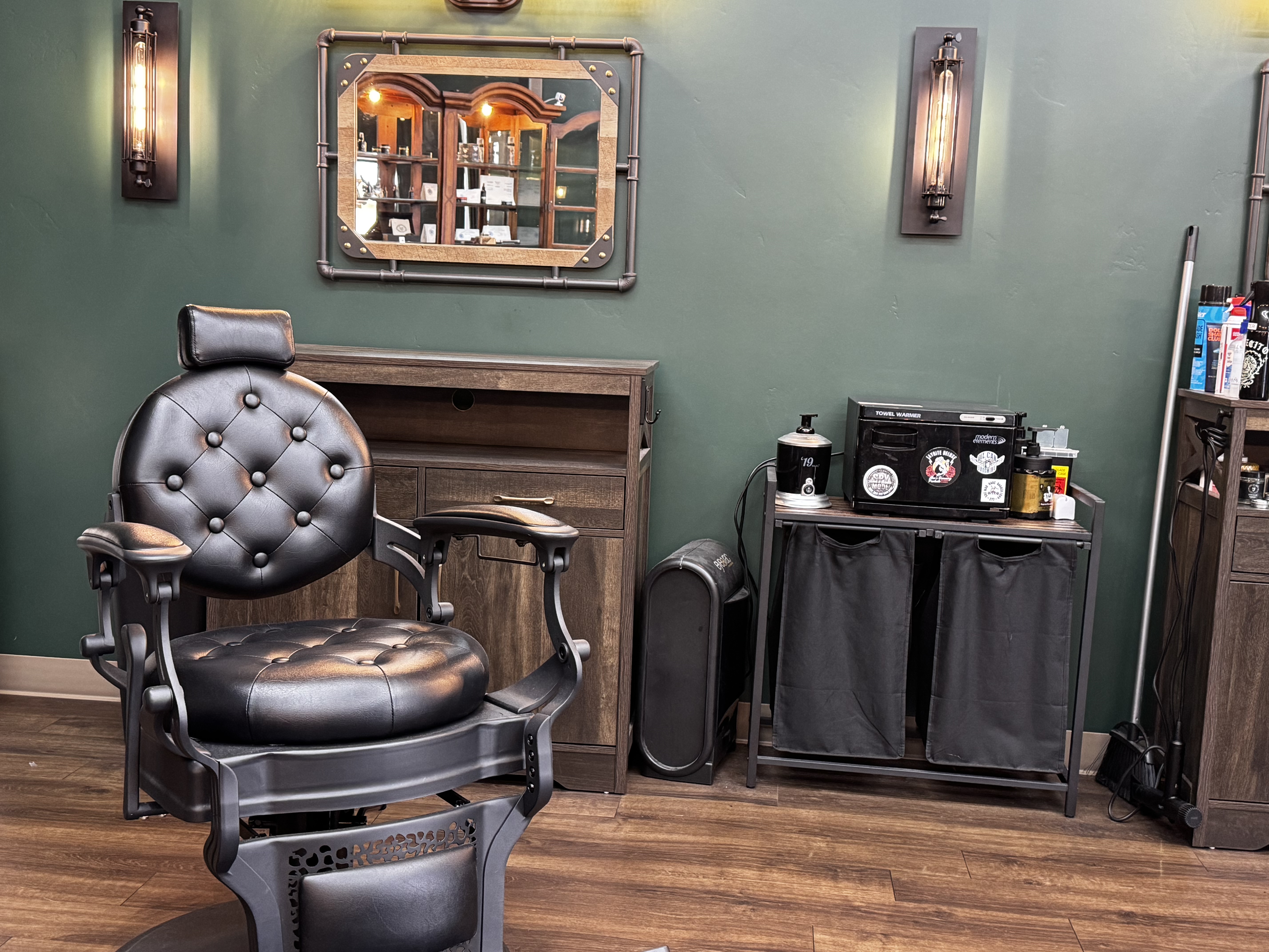 Black barber chair and station inside Mad Hare Barber
