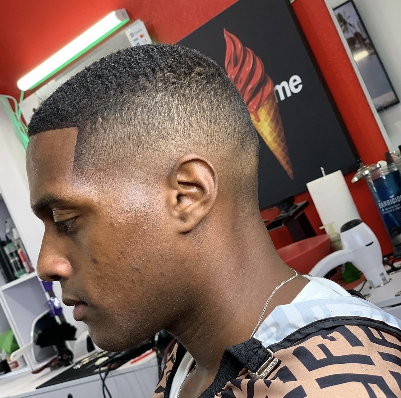 Clean taper fade finished at the chair