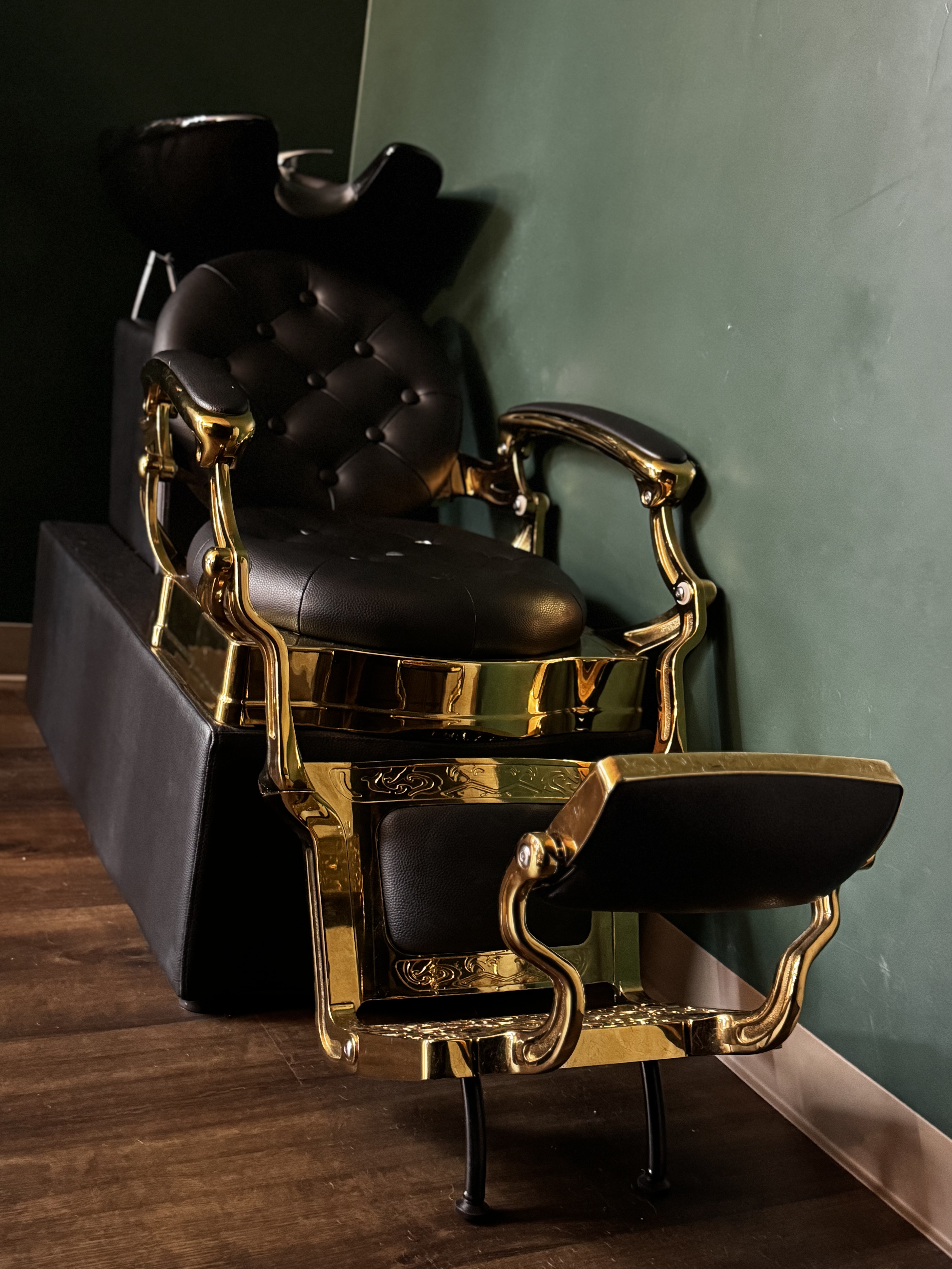 Black and gold wash chair at Mad Hare Barber